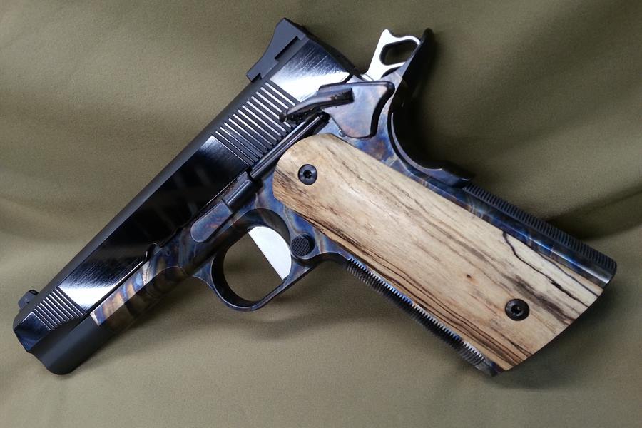 Custom 1911 Government with color case-hardened frame, blued slide and spalted maple grips