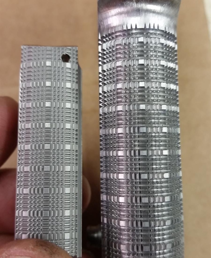 Hand-cut skip-line checkering on a 1911 front strap and mainspring housing